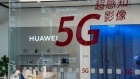 Signage for Huawei Technologies Co. is displayed at one of the company's stores in Beijing, China, on Friday, Sept. 11, 2020. 