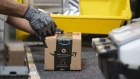 An employees places a label on a box at the Amazon.com Inc. fulfillment center in Baltimore, Maryland, U.S., on Tuesday, April 30, 2019. Amazon.com will spend $800 million in the current quarter to reduce delivery times for top customers to one day from two, trying to revive its main e-commerce franchise and ward off greater competition. Photographer: Melissa Lyttle/Bloomberg