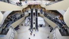 Shoppers walk through the Queens Center shopping mall in the Queens borough of New York, on Sept. 9.