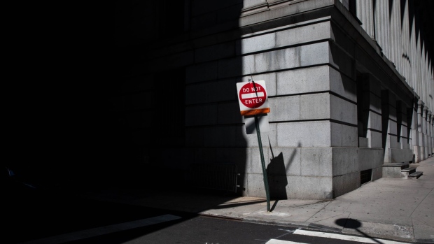 A "Do Not Enter" street sign stands along Wall Street near the New York Stock Exchange. Photographer: Michael Nagle/Bloomberg