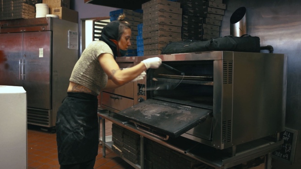 Ovens are good for making pizza and face shields at Dimo’s Pizza in Chicago. Photographer: Aaron Fedor/Bloomberg
