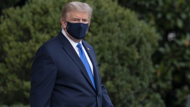 U.S. President Donald Trump walks to the South Lawn of the White House before boarding Marine One in Washington, D.C., U.S., on Friday, Oct. 2, 2020. Trump will be taken to Walter Reed National Military Medical Center to be treated for Covid-19, the White House said.