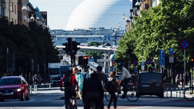 The Globe arena stand on the city skyline beyond a highway in Stockholm, Sweden, on Wednesday, June 28, 2017. Just as Sweden’s biggest mortgage banks start raising interest rates, the country’s state-backed home-loan provider says it’s cutting customers’ borrowing costs in a move that threatens to hurt industry profits after years of negative rates. Photographer: Mikael Sjoberg/Bloomberg