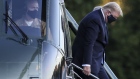 Donald Trump exits Marine One while arriving at Walter Reed National Military Medical Center in Bethesda, Maryland, on Oct. 2. Photographer: Oliver Contreras/Bloomberg