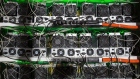 Racks of application-specific integrated circuit (ASIC) devices and power units operate inside a rack at the BitRiver Rus LLC cryptocurrency mining farm in Bratsk, Russia, on Friday, Nov. 8, 2019. Bitriver, the largest data center in the former Soviet Union, was opened just a year ago, but has already won clients from all over the world, including the U.S., Japan and China. Most of them mine bitcoins. Photographer: Andrey Rudakov/Bloomberg