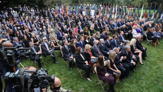 WASHINGTON, DC - SEPTEMBER 26: Guests watch as U.S. President Donald Trump introduces 7th U.S. Circuit Court Judge Amy Coney Barrett as his nominee to the Supreme Court in the Rose Garden at the White House September 26, 2020 in Washington, DC. With 38 days until the election, Trump tapped Barrett to be his third Supreme Court nominee in just four years and to replace the late Associate Justice Ruth Bader Ginsburg, who will be buried at Arlington National Cemetery on Tuesday. (Photo by Chip Somodevilla/Getty Images)