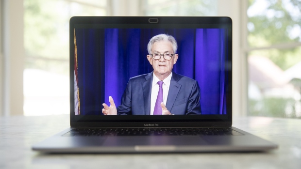 Jerome Powell, chairman of the U.S. Federal Reserve, speaks during a virtual news conference seen on a laptop computer in Tiskilwa, Illinois, U.S., on Wednesday, Sept. 16, 2020. The Federal Reserve left interest rates near zero and signaled it would hold them there through at least 2023 to help the U.S. economy recover from the coronavirus pandemic. Photographer: Daniel Acker/Bloomberg