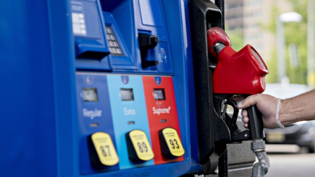 A customer wearing a protective glove returns a fuel nozzle after refueling at an Exxon Mobil Corp. gas station in Arlington, Virginia, U.S., on Wednesday, April 29, 2020. Exxon is scheduled to released earnings figures on May 1. Photographer: Andrew Harrer/Bloomberg