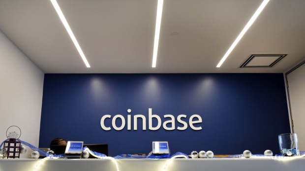 Signage is displayed at the front desk of the Coinbase Inc. office in San Francisco, California, U.S., on Friday, Dec. 1, 2017. Coinbase wants to use digital money to reinvent finance. In the company's version of the future, loans, venture capital, money transfers, accounts receivable and stock trading can all be done with electronic currency, using Coinbase instead of banks. Photographer: Michael Short/Bloomberg