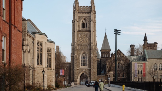 Pedestrians walk through the University of Toronto campus in Toronto, Ontario, Canada, on Tuesday, April 28, 2020.