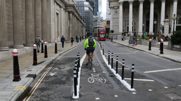 Bollards protect a cycle lane and an extended pedestrian area outside the Bank of England in the Square Mile financial district of the City of London.