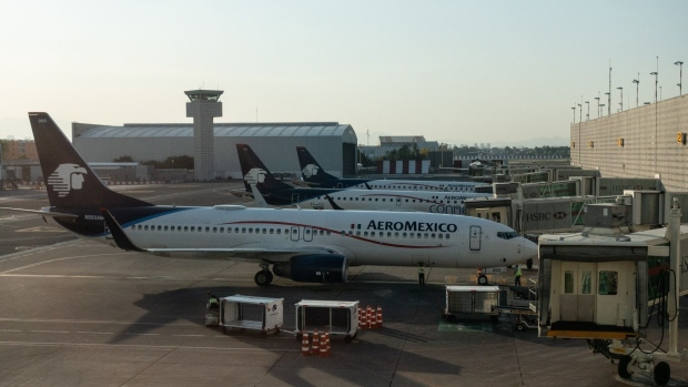 Grupo Aeromexico aircraft at Benito Juarez International Airport (MEX) in Mexico City, Mexico, on Wednesday, Oct. 7, 2020. Grupo Aeroportuario del Sureste SAB, the operator of airports in southern Mexico and Puerto Rico, said passenger traffic fell 58.6 percent in September from a year ago. Photographer: Cesar Rodriguez/Bloomberg