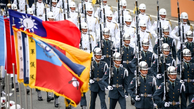 Members of National Defense Honor Guard march during National Day celebrations in Taipei, Taiwan, on Saturday, Oct. 10, 2020. Taiwan president Tsai Ing-wen called for dialogue with Beijing while vowing to defend the island in the face of Chinese intimidation.