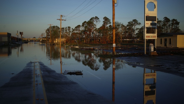 Floodwater sits on a street after Hurricane Delta made landfall in Lake Charles, Louisiana, U.S., on Saturday, Oct. 10, 2020. Delta weakened to a tropical depression as it moved inland over northeastern Louisiana, knocking out power lines and drenching an area still recovering from the onslaught of Hurricane Laura.