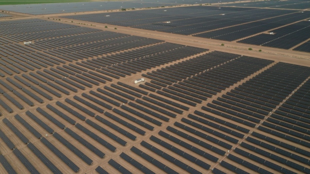 Photovoltaic panels are seen near the U.S.-Mexico border in this aerial photograph taken over the Mount Signal Solar Farm in Calexico, California, U.S. on Friday, Sept. 11, 2020. As the threat of blackouts continues to plague California, officials are pointing to battery storage as a key to preventing future power shortfalls. But the Golden State is going to need a lot more batteries to weather the next climate-driven crisislet alone to achieve its goal of a carbon-free grid. Photographer: Bing Guan/Bloomberg