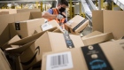 An employee scans a package at an Amazon.com fulfillment center in Kegworth, U.K., on Oct. 12.