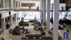 People sit in the Town Square meeting area at the new Citigroup Inc. headquarters in New York, U.S., on Tuesday, Dec. 3, 2019. Citigroup's trading floors - long known for being festooned with flags marking the home countries of its hundreds of traders, and banners touting years of good performance - have gotten swankier, with floor-to-ceiling windows, desks outfitted with 43-inch computer monitors and small cafeterias on every floor.