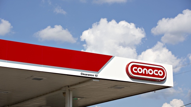 Signage is displayed at a ConocoPhillips gas station in Peoria, Illinois, U.S., on Tuesday, July 24, 2018. ConocoPhillips is scheduled to release earnings figures on July 26. Photographer: Daniel Acker/Bloomberg