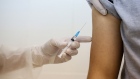 A heath worker prepares to inject the 'Gam-COVID-Vac', also known as 'Sputnik V', COVID-19 vaccine, developed by the Gamaleya National Research Center for Epidemiology and Microbiology and the Russian Direct Investment Fund (RDIF), into a patient's arm during a post-registration phase trial at the City Clinic #46 in Moscow on Sept. 23.