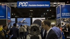 Attendees pass the Precision Castparts Corp. booth during the Berkshire Hathaway Inc. annual shareholders meeting in Omaha, Nebraska in 2016.