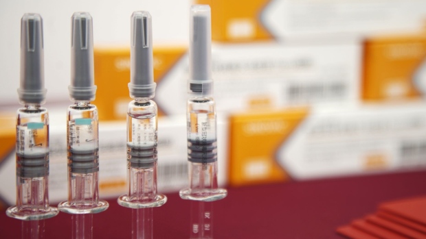 Vials of Sinovac Biotech Ltd.'s CoronaVac SARS-CoV-2 vaccine are displayed at a media event in Beijing, China, on Thursday, Sept. 24, 2020. Chinese vaccine developer Sinovac said that countries running its final-stage clinical trials like Brazil, Indonesia and Turkey will get its coronavirus shots at the same time as China, underscoring how vaccine supply agreements could cement diplomatic ties in the Covid-19 era.