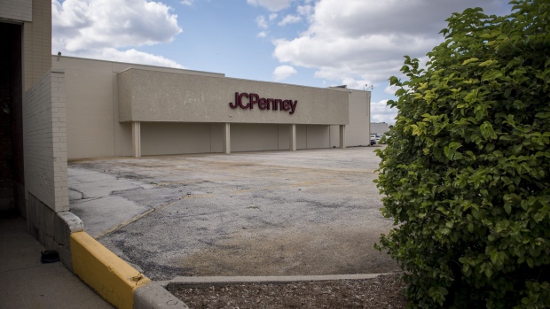 Signage is displayed outside a JC Penney store in Chicago. Photographer: Christopher Dilts/Bloomberg