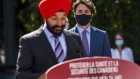 Justin Trudeau, Canada's prime minister, right, listens while Navdeep Bains, Canada's innovation, science and industry minister, speaks at the National Research Council of Canada (NRC) Royalmount Human Health Therapeutics Research Centre facility in Montreal, Quebec, Canada, on Monday, Aug. 31, 2020.