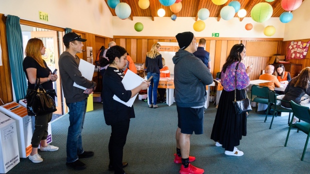 Voters wait to cast their votes at the Aro Valley Community Centre polling station in Wellington, Oct. 17.