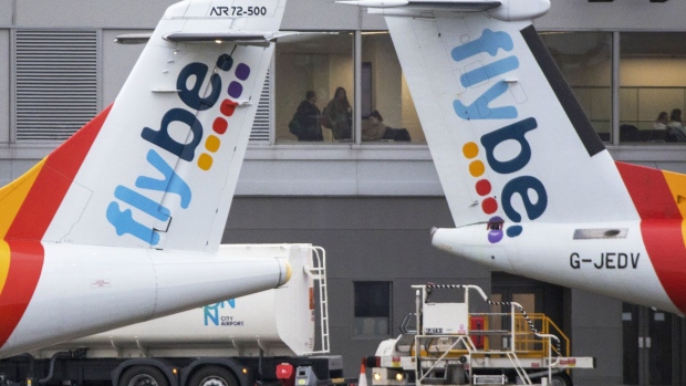 Tailfins from passenger aircraft operated by Flybe Group Plc stand on the tarmac at London City Airport in London, U.K., on Tuesday, Jan. 14, 2020. Photographer: Chris Ratcliffe/Bloomberg