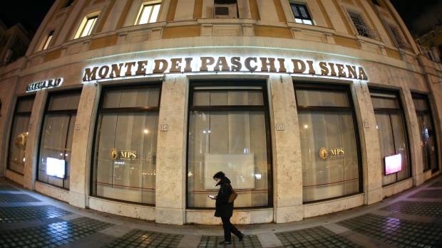 A pedestrian passes a Banca Monte dei Paschi di Siena SpA bank branch in Rome, Italy.