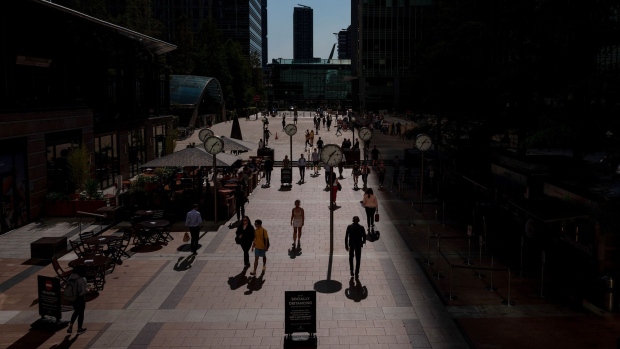 Pedestrians walk in the Canary Wharf business, financial and shopping district of London, on Sept. 14, 2020. Photographer: Simon Dawson/Bloomberg
