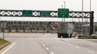 A truck approaches the Canada-U.S. border in Saint-Bernard-de-Lacolle, Quebec, Canada, on Wednesday, Sept. 16, 2020. The U.S. and Canada will extend restrictions on travel across the border until at least Oct. 21, CBC News reported, citing a person with direct knowledge of the situation. Photographer: Christinne Muschi/Bloomberg