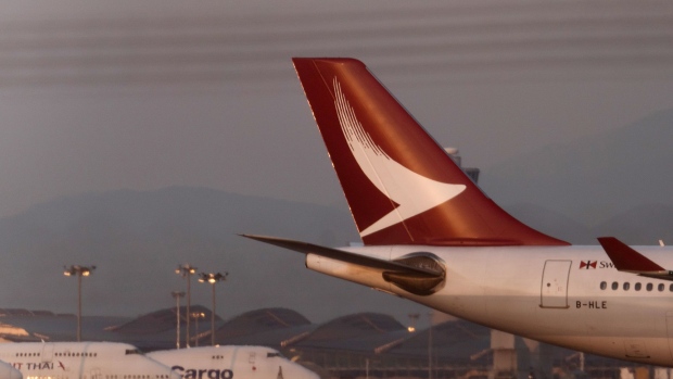 An Airbus SE A330-342 aircraft operated by Cathay Dragon, a unit of Cathay Pacific Airways Ltd., prepares to land at Hong Kong International Airport in Hong Kong, China, on Saturday, March 11, 2018. Cathay Pacific is expected to report a full-year net loss of HK$2.7 billion ($345 million) for 2017, after a first-half deficit of HK$2.05 billion, according to the median estimate in a Bloomberg News survey of five analysts. Photographer: Anthony Kwan/Bloomberg