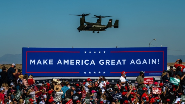 A V-22 Osprey aircraft, with U.S. President Donald Trump on board, arrives at a Make America Great Again rally in Prescott, Arizona, U.S., on Monday, Oct. 19, 2020. The Covid-19 pandemic is disproportionately affecting some crucial voters two weeks before Election Day, costing American lives and potentially hurting President Donald Trump, who has received overwhelmingly poor grades from Democrats and independent voters on his virus response. Photographer: Ash Ponders/Bloomberg