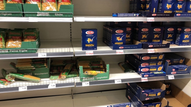 Packets of dried pasta, manufactured by Buitoni, a unit of Nestle SA, and Barilla Holding SpA, sit beside empty shelf space inside a Edeka Group supermarket in Berlin, Germany, on Wednesday, March 11, 2020. Governments struggling to contain the global economic fallout from the coronavirus outbreak face mounting calls to unleash a major fiscal stimulus that could help cushion the blow. Photographer: Krisztian Bocsi/Bloomberg