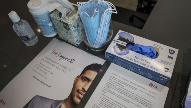Antiseptic wipes, hand sanitizer, protective masks and gloves at a JLL office in Menlo Park, California, U.S., on Tuesday, Sept. 15, 2020. Constraints such as social distancing and masks mean the precise nature of the future office working environment remains an open question even as some signs of normality return with some workers returning to their desks.