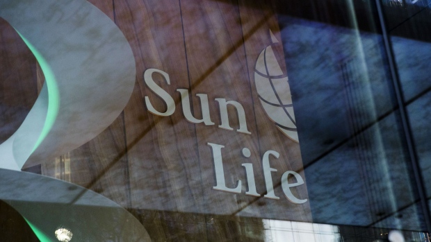 Signage is illuminated outside the Sun Life Financial Inc. headquarters in Toronto, Ontario, Canada, on Sunday, Aug. 11, 2019. 