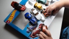 A child plays with Mattel Inc. Hot Wheels