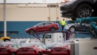Tesla Inc. vehicles are unloaded from car carriers before being shipped from the Port of San Francisco in San Francisco, California, U.S., on Thursday, Feb. 7, 2019. Tesla is loading as many Model 3 sedans as it can onto vessels destined for China ahead of March 1, when a trade-war truce between presidents Donald Trump and Xi Jinping is scheduled to expire.