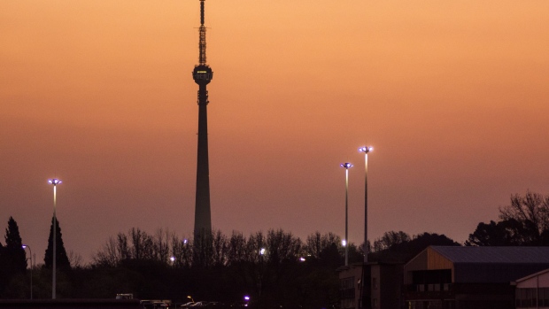 The Sentech television tower, also known as the Brixton tower, stands on the city skyline as night falls in the central business district of Johannesburg, South Africa, on Tuesday, Aug. 8, 2019. Eskom Holdings SOC Ltd., South Africa’s biggest polluter, said emissions of particulate matter that cause chronic respiratory disease are at their highest level in two decades as the state power utility’s financial meltdown has seen it skip maintenance and has triggered strikes.