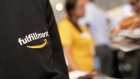 A fulfillment recruiter stands during an Amazon Career Day event in Arlington, Virginia, U.S., on Tuesday, Sept. 17, 2019. Amazon.com Inc. is hosting the event in six regions across the U.S. where potential employees can learn about the 30,000 full and part-time jobs available at Amazon, with over 1,600 full and part-time open positions in Arlington and other locations in Virginia. Photographer: Andrew Harrer/Bloomberg
