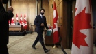 Justin Trudeau leaves an Ottawa news conference on Oct. 9.