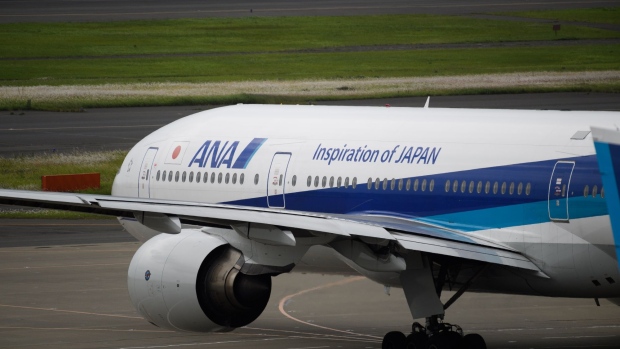 An All Nippon Airways Co. (ANA) aircraft taxis at Haneda Airport in Tokyo, Japan, on Tuesday, May 28, 2019. Japan's foreign tourist arrivals rose 3.7 percent in May, from a year earlier, according to the Japan National Tourism Organization. Photographer: Akio Kon/Bloomberg