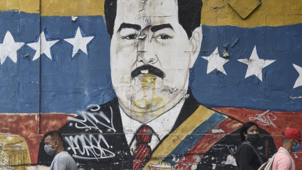 A mural of President Nicolas Maduro in the Petare neighborhood of Caracas. Photographer: Carlos Becerra/Bloomberg