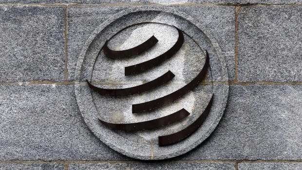 A logo stands on the wall outside the World Trade Organisation (WTO) headquarters in Geneva, Switzerland, on Monday, March 2, 2020. Liz Truss, the U.K.’s international trade secretary, will tell WTO members on Tuesday that the nation intends to “turn the rise in protectionist measures around.”
