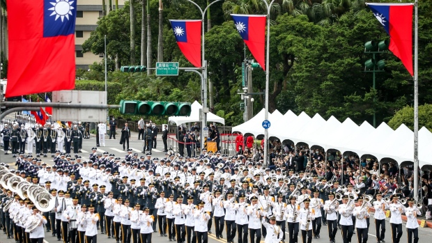 The Joint Military Marching Band perform during National Day celebrations in Taipei, Taiwan, on Saturday, Oct. 10, 2020. Taiwan president Tsai Ing-wen called for dialogue with Beijing while vowing to defend the island in the face of Chinese intimidation. Photographer: I-Hwa Cheng/Bloomberg
