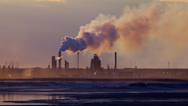 Steam rises from a Syncrude Canada Ltd. facility in the Athabasca oil sands north of Fort McMurray, Alberta, Canada, on Friday, June 14, 2019. Once the booming heart of the country's energy industry, the little city of 75,000 in northeastern Alberta has become a showcase for the debt troubles many Canadians are facing.