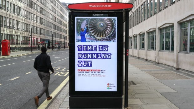 A pedestrian passes a U.K. government Brexit advertisement at a bus stop in London, U.K., on Thursday, Oct. 22, 2020. The U.K. and the European Union will resume talks over a post-Brexit trade deal, less than a week after Boris Johnson suspended the discussions, amid growing signs an accord is in sight. Photographer: Simon Dawson/Bloomberg