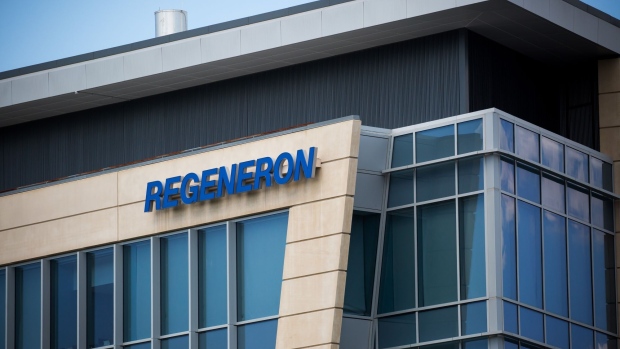 Regeneron Pharmaceuticals Inc. signage is displayed outside their headquarters in Tarrytown, N.Y., U.S., on June 12, 2020. Regeneron Pharmaceuticals Inc. said it had begun human trials of a new antibody cocktail for Covid-19, part of an ambitious clinical-testing plan that could lead to a new treatment option by the end of summer if all goes well. Photographer: Michael Nagle/Bloomberg