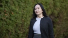 Meng Wanzhou, chief financial officer of Huawei Technologies Co., leaves her home to attend Supreme Court for a hearing in Vancouver, British Columbia, Canada, on Monday, Oct. 26, 2020. Canadian border and police officials involved in the 2018 arrest of Meng will testify this week in her long-running legal fight to avoid extradition to the U.S.